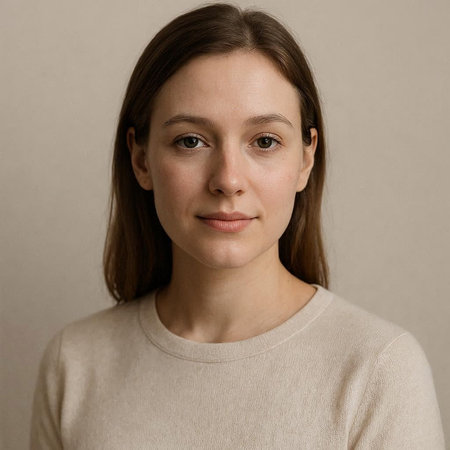 Portrait of a young woman with brown hair and freckles