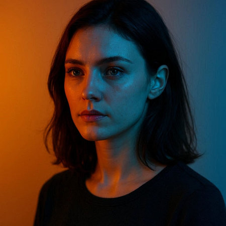 Portrait of a young woman in a black T-shirt.
