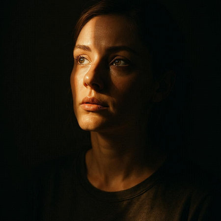 Portrait of a young woman on a dark background. Studio shot.
