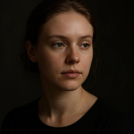 Portrait of a beautiful young woman with freckles on her face