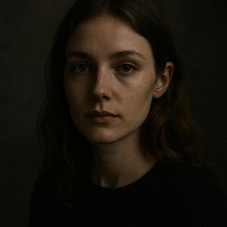 Portrait of a young woman on a dark background. Studio shot.