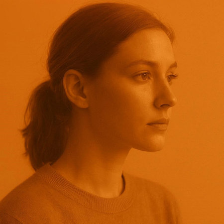 Portrait of a young woman on a yellow background. Toned.