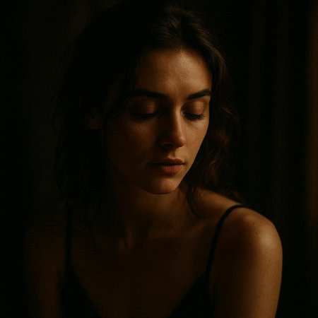 Portrait of a young beautiful woman with closed eyes in dark room
