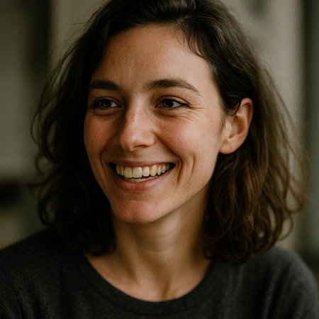 Portrait of a young woman smiling and looking at the camera.