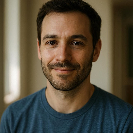Portrait of a handsome man smiling and looking at the camera.