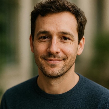 Portrait of a handsome young man with a beard looking at the camera