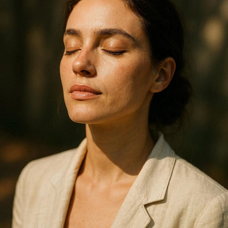 Portrait of a young beautiful brunette woman with closed eyes in a beige jacket.