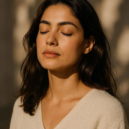 Portrait of a beautiful young woman with closed eyes in the sunlight