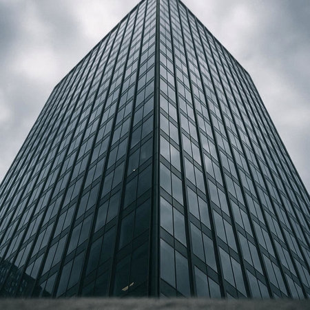 Reflection of a skyscraper in a glass window, modern architecture