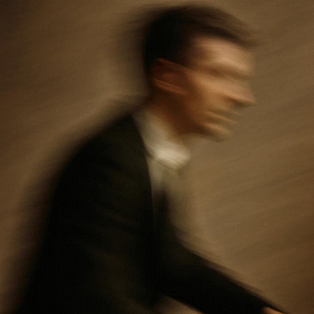 Abstract image of a man in a suit. Motion blur effect.