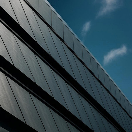 Modern office building with sky reflection. Architectural detail of modern building.