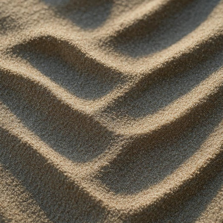 Close up of sand pattern on beach. Abstract background and texture for design.