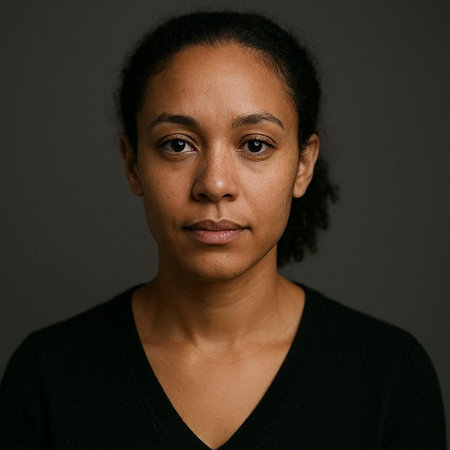 Portrait of a young African American woman in a black sweater.