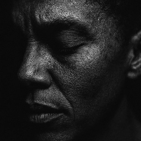 Portrait of a black man with closed eyes. Close-up.