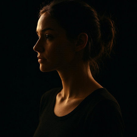 Portrait of a young beautiful woman on a black background. Studio shot.の写真素材