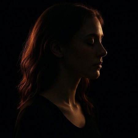 Portrait of a beautiful young woman with red hair on a black background