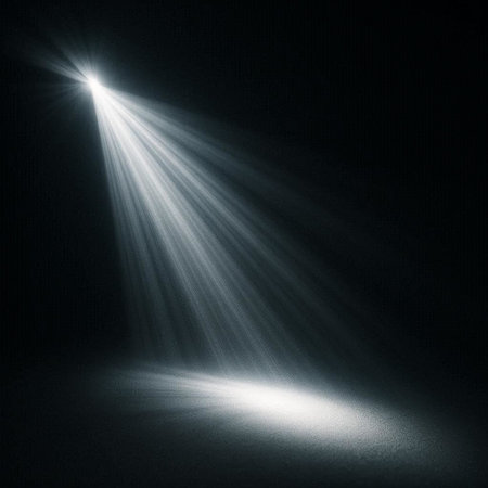 spotlight on a dark background with rays of light from the center