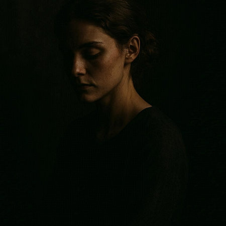 Portrait of a young woman on a dark background. Toned.の写真素材