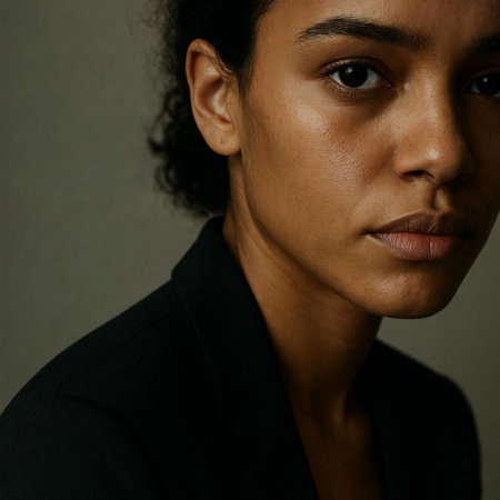 Portrait of a young African-American woman on a dark background