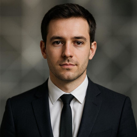 Portrait of a handsome young man wearing a suit and tie.