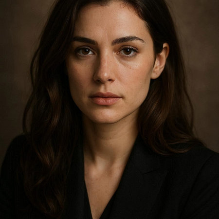 Portrait of a beautiful young brunette woman in a black suit