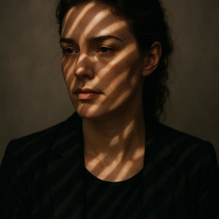 Portrait of a woman with shadows on her face. Studio shot.