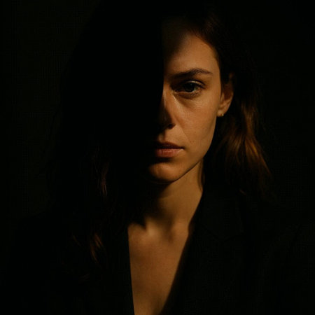 Portrait of a beautiful brunette woman in a black jacket on a dark background