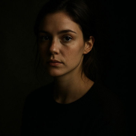 Portrait of a young woman on a dark background in the dark
