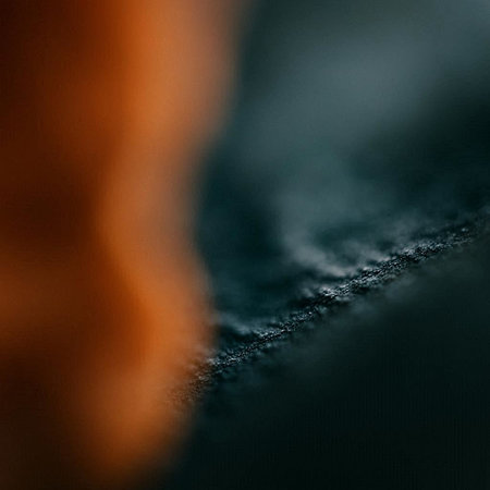 abstract background: black and blue leather with some damage on itの写真素材