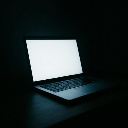 Laptop with blank white screen on dark background. Mock up.の写真素材