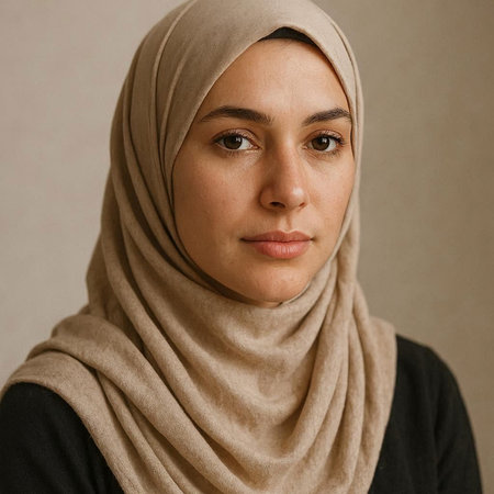 Portrait of a young muslim woman with hijab looking at camera