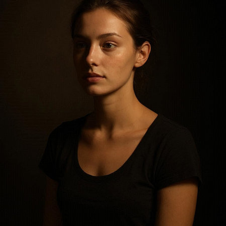 Portrait of a beautiful young brunette woman on a dark background