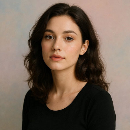 Portrait of a beautiful young woman with long brown curly hair.