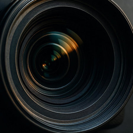 Close-up of a camera lens on a black background. Macro photography