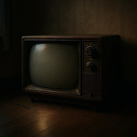 Vintage TV on the wooden floor in the dark room. Television concept.