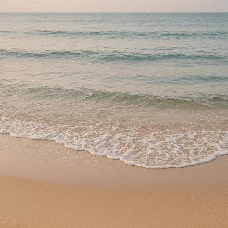 Soft wave of the sea on the sandy beach. Vintage tone.