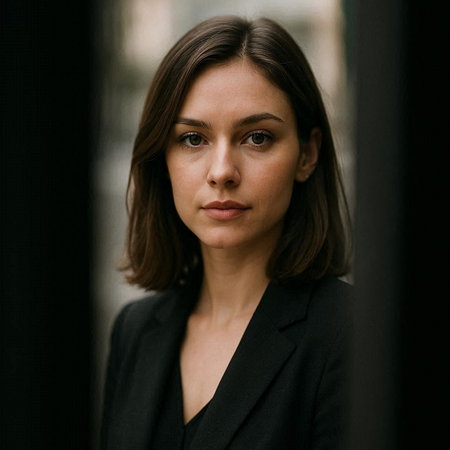 Portrait of a young beautiful business woman in a black suit.