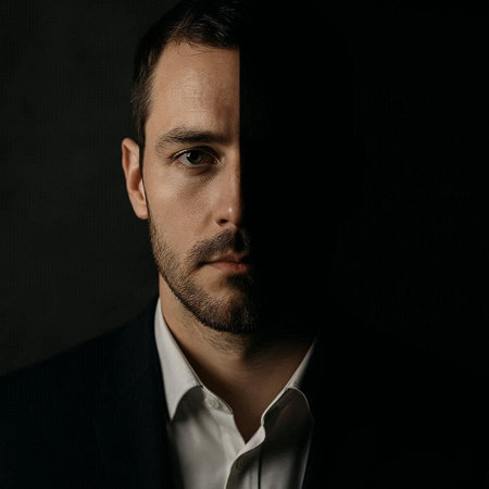 Portrait of a handsome man in a suit on a dark background