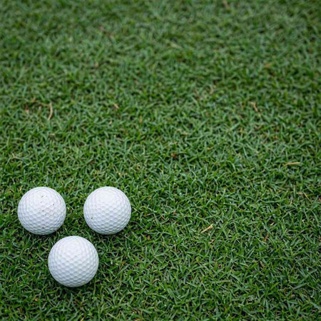 Golf ball on green grass background, golf ball on green grass background
