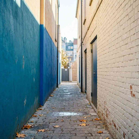 Brick wall in a narrow street in the old town of Amsterdam