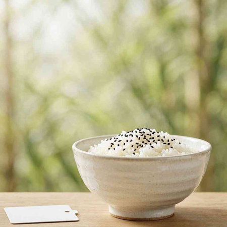 Rice in a bowl with space for text on wooden table.