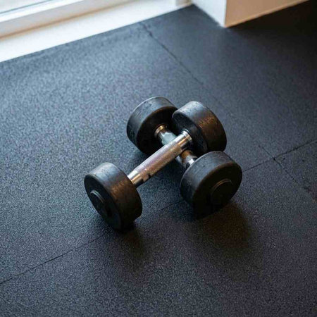 Dumbbells on the floor in the gym. Fitness concept