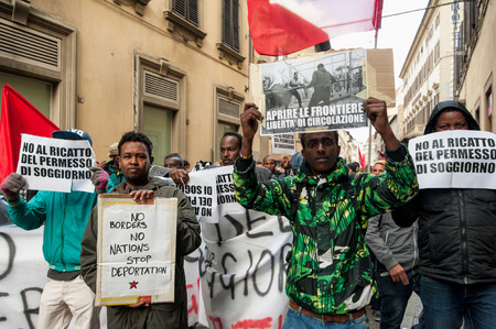 Florence, Italy - March 12, 2016: A march of immigrants in the streets of downtown, against war, demanding work and freedom.のeditorial素材