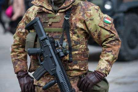 an Italian military army, in combat gear, guarding a strategic objective.の写真素材