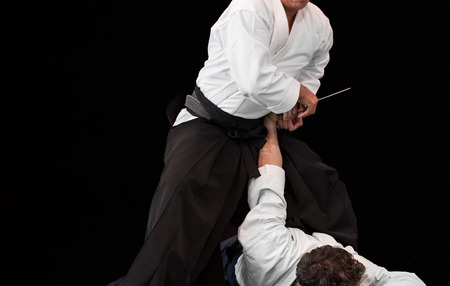 aikido master disarms his opponent during a public fight demonstrationの写真素材