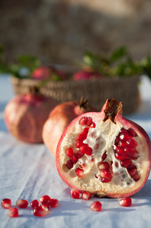 Pomegranate chopped on a tableの写真素材