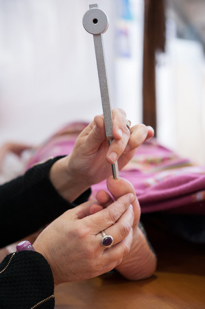 the music therapist takes care of the patient with tuning forkの写真素材