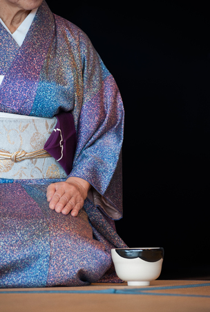 a japanese woman shows the tea ceremony during a public demonstrationの写真素材