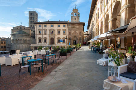 Arezzo, Italy - 2020, 30 October: Restaurants and bars in front of the Vasari Loggia, on Piazza Grande.のeditorial素材