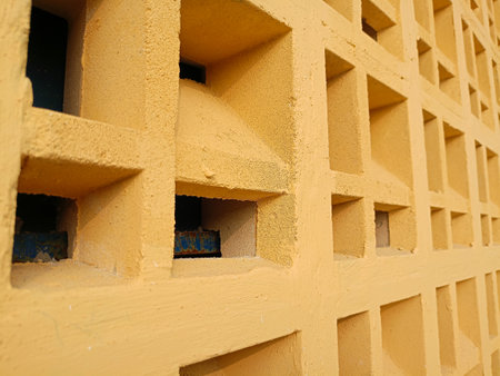 Decorative square shaped air vent wall, yellow concrete roster wall variation